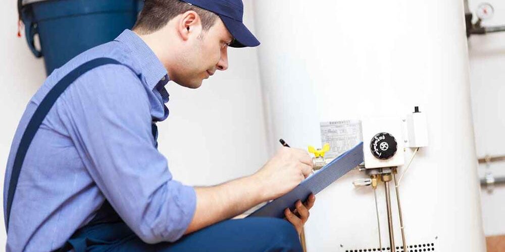 a person checking their water heater tank